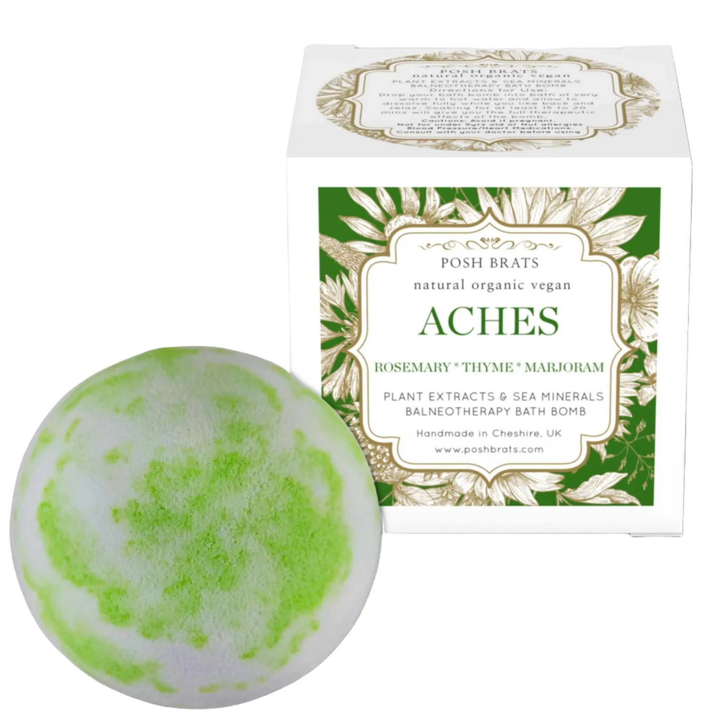 A green and white Aches Aromatherapy Bath Bomb by Posh Brats sits next to its packaging, made with natural, organic vegan ingredients like rosemary, thyme, and marjoram. Its infused with essential oils and sea minerals for ultimate muscle relief.
