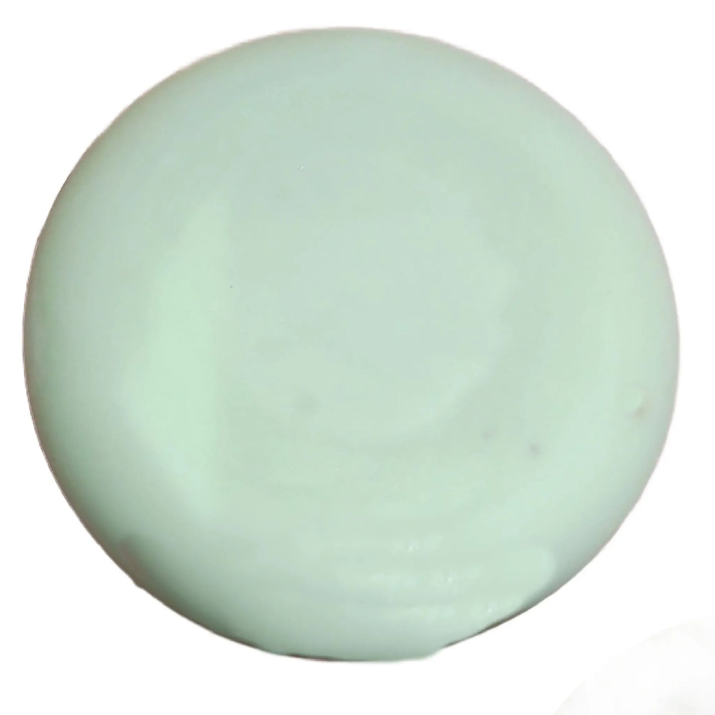 A smooth, mint-green jade gemstone sits against a plain white background, its polished surface glossy like the soothing qualities of Posh Brats Wild Highland Bog Myrtle Cleansing Bar.