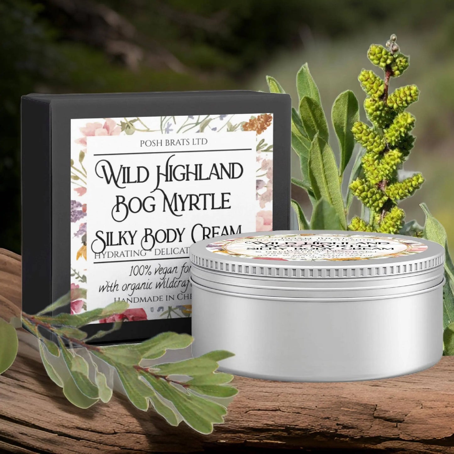A container of Posh Brats Wild Highland Bog Myrtle Silky Body Butter Cream features floral designs amid natural greenery, highlighting its vegan, organic infusion of Scottish bog myrtle and Highland herbs.