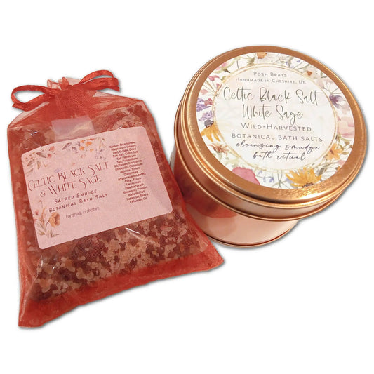 A jar with a floral label and gold accents, and a red sachet showcasing pinkish salts, both elegantly labeled sacred smudge botanical bath salt, containing Posh Brats Celtic Black Salt White Sage Smudge Bath Salt.