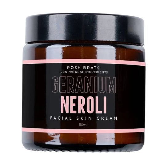 A 50ml Posh Brats Geranium Neroli Skin Cream jar with a black lid, featuring a label in black, white, and pink, claims 100% Natural Ingredients for skin-balancing with rich botanical extracts.