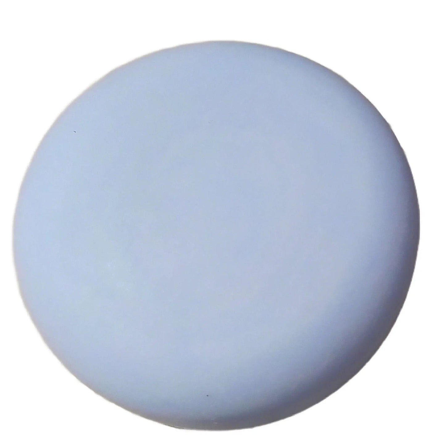 A smooth, round blue button on a pristine background captures the gentle allure of Posh Brats Heather Honey + Goat Milk Facial Cleansing Bar.