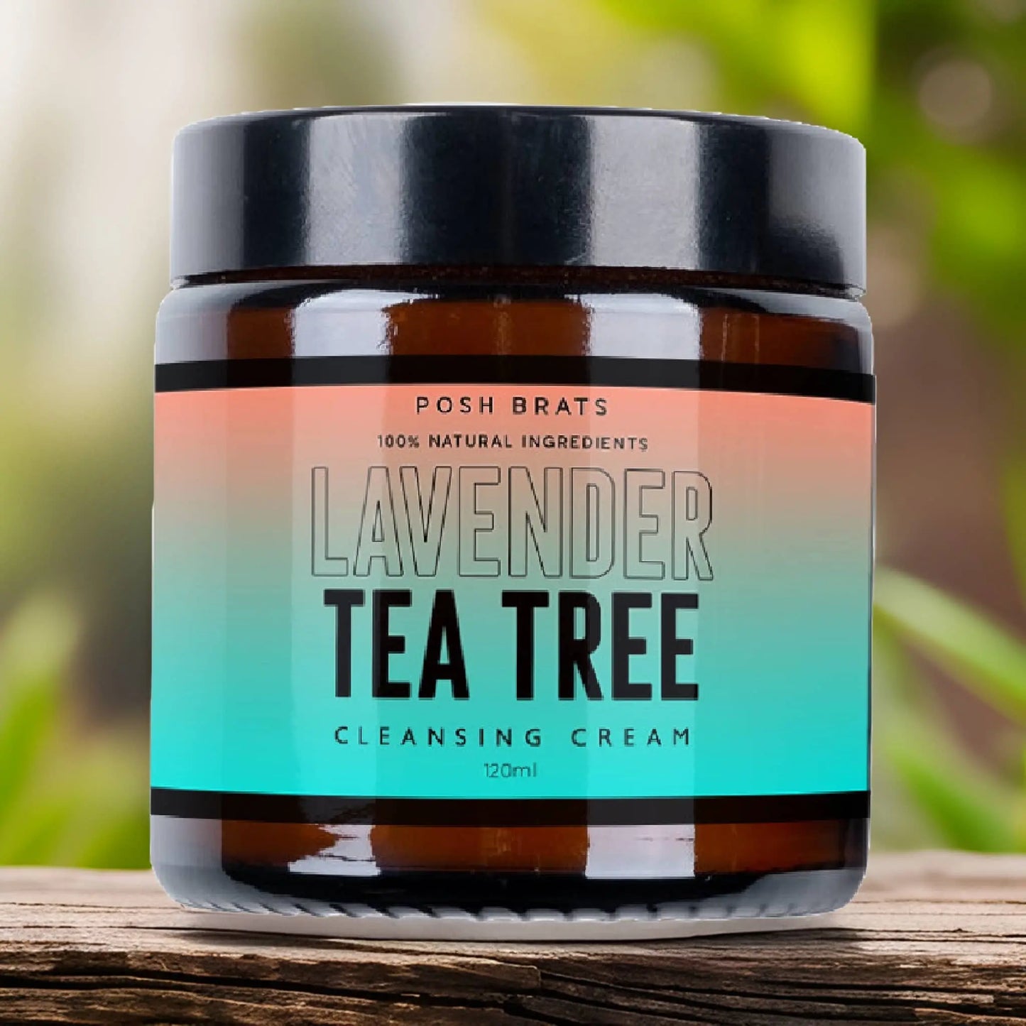 A 120ml jar of Posh Brats Lavender Tea Tree Clear Skin Cleansing Cream is featured against a blurred natural backdrop. The label, showcasing vegan-friendly skincare, highlights its gradient design with text emphasizing natural essential oils and ingredients.