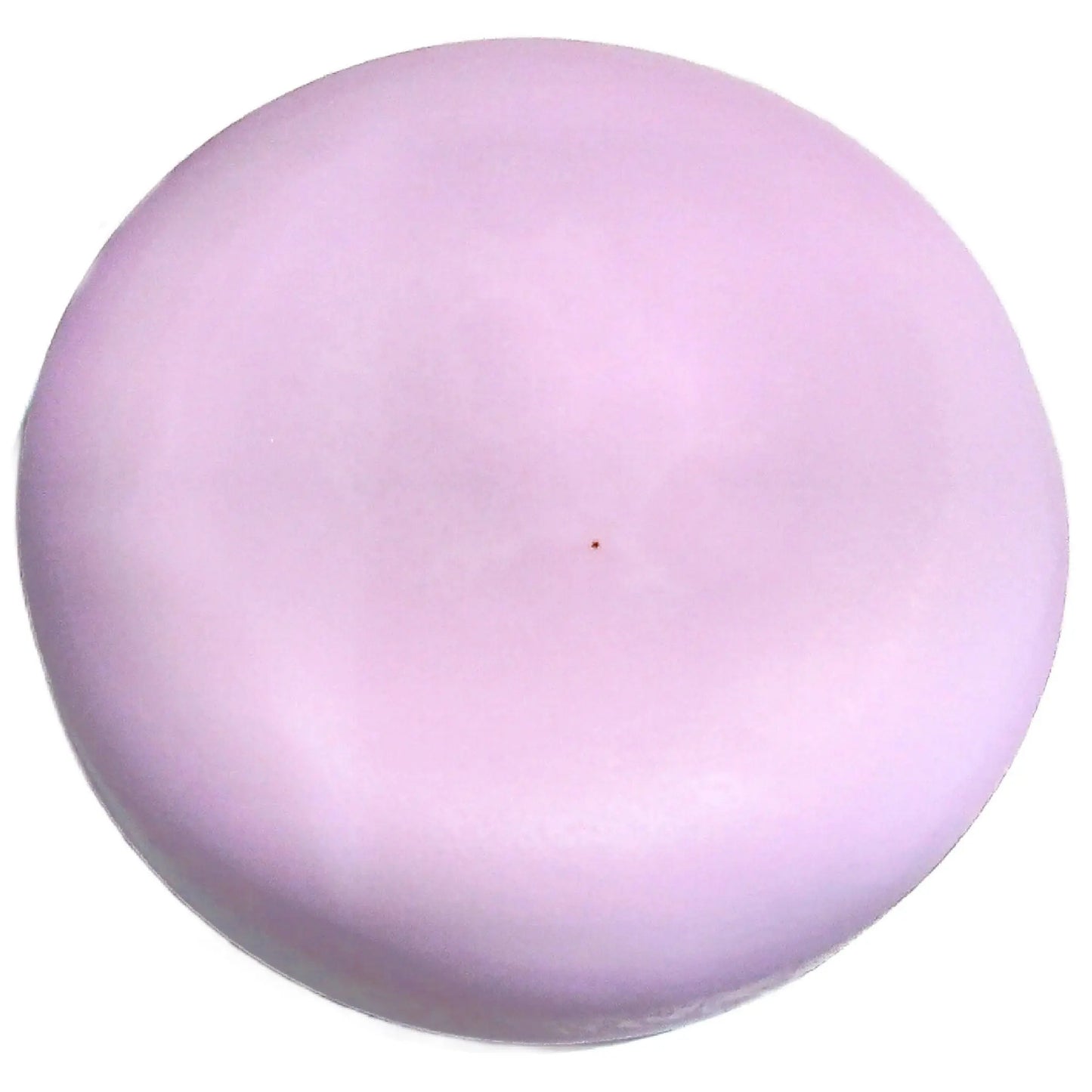 A smooth, round, pale pink facial cleansing bar from Posh Brats, the Wild Lilac Blossom Cleansing Bar resembles a soft disk. Its subtle color and texture stand out against a plain white background.