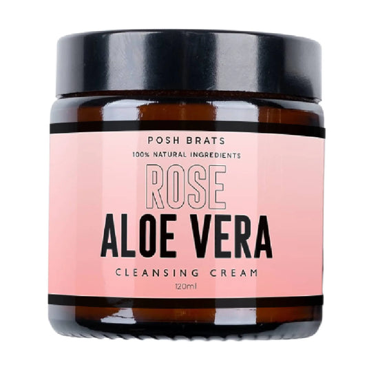 The Posh Brats Rose Aloe Vera Cleansing Cream, infused with rose oil, is packaged in a chic brown jar with a black lid and pink label reading 100% Natural Ingredients. This 120 ml cream provides a luxurious cleanse.
