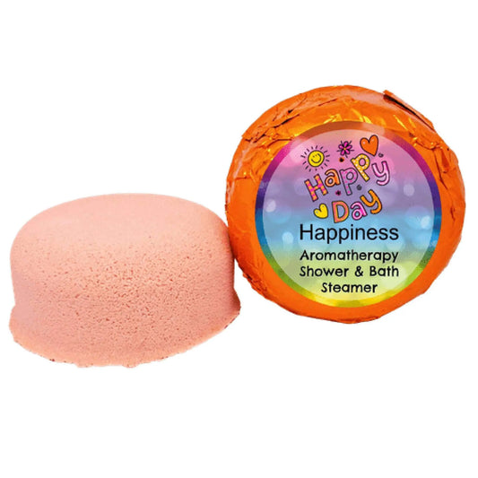 The Posh Brats Happiness Aromatherapy Shower Steamer, a pink round bath product wrapped in orange foil labeled Happy Day Happiness, features colorful graphics and is infused with uplifting citrus notes and essential oils for a joyful bathing experience.