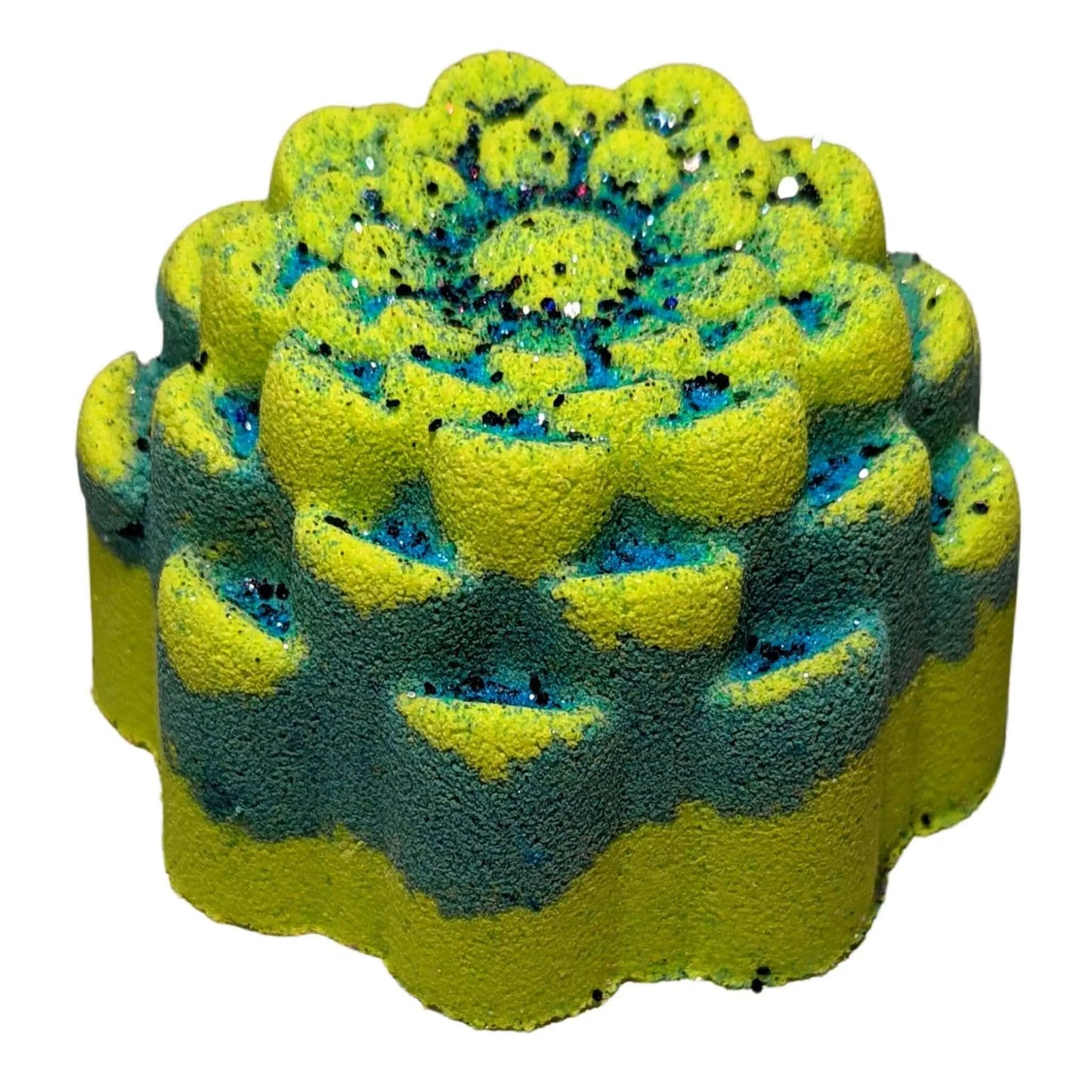 The Aloha Paradise Fizzy Bath Bomb by Posh Brats offers a floral escape with its yellow and green hues, accented by blue and black glitter. Infused with essential oils, it creates a dreamy tropical vibe against a white background.