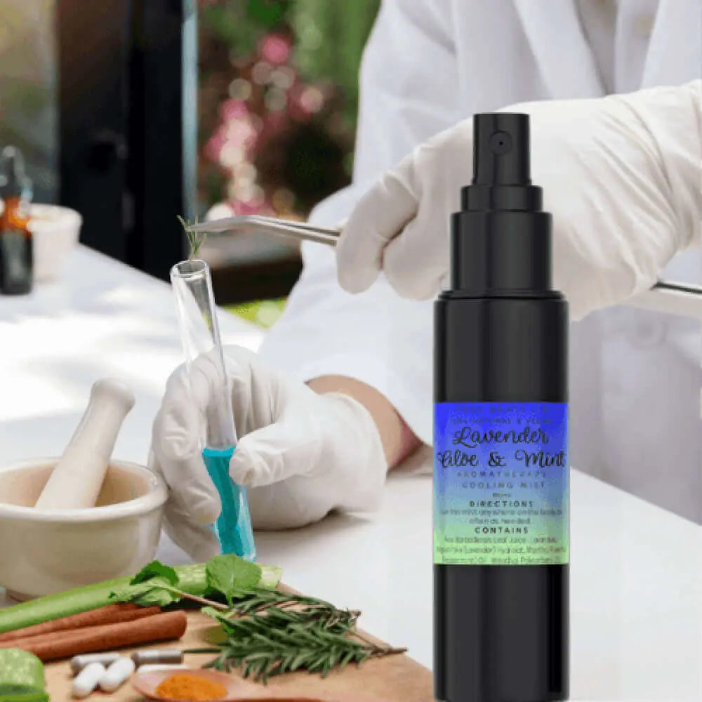 A person in white gloves handles a test tube with blue liquid while, in the foreground, a black bottle labeled Lavender Aloe Vera Mint Aromatherapy Cooling Mist by Posh Brats offers invigorating hydration amidst herbs, aloe vera, a mortar and pestle, and glassware.