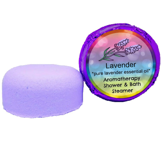 Posh Brats Lavender Aromatherapy Shower Steamer, decorated with lavender imagery on a rainbow gradient, emits a calming scent. Alongside sits an unwrapped version, ready to turn your bath into a tranquil escape.