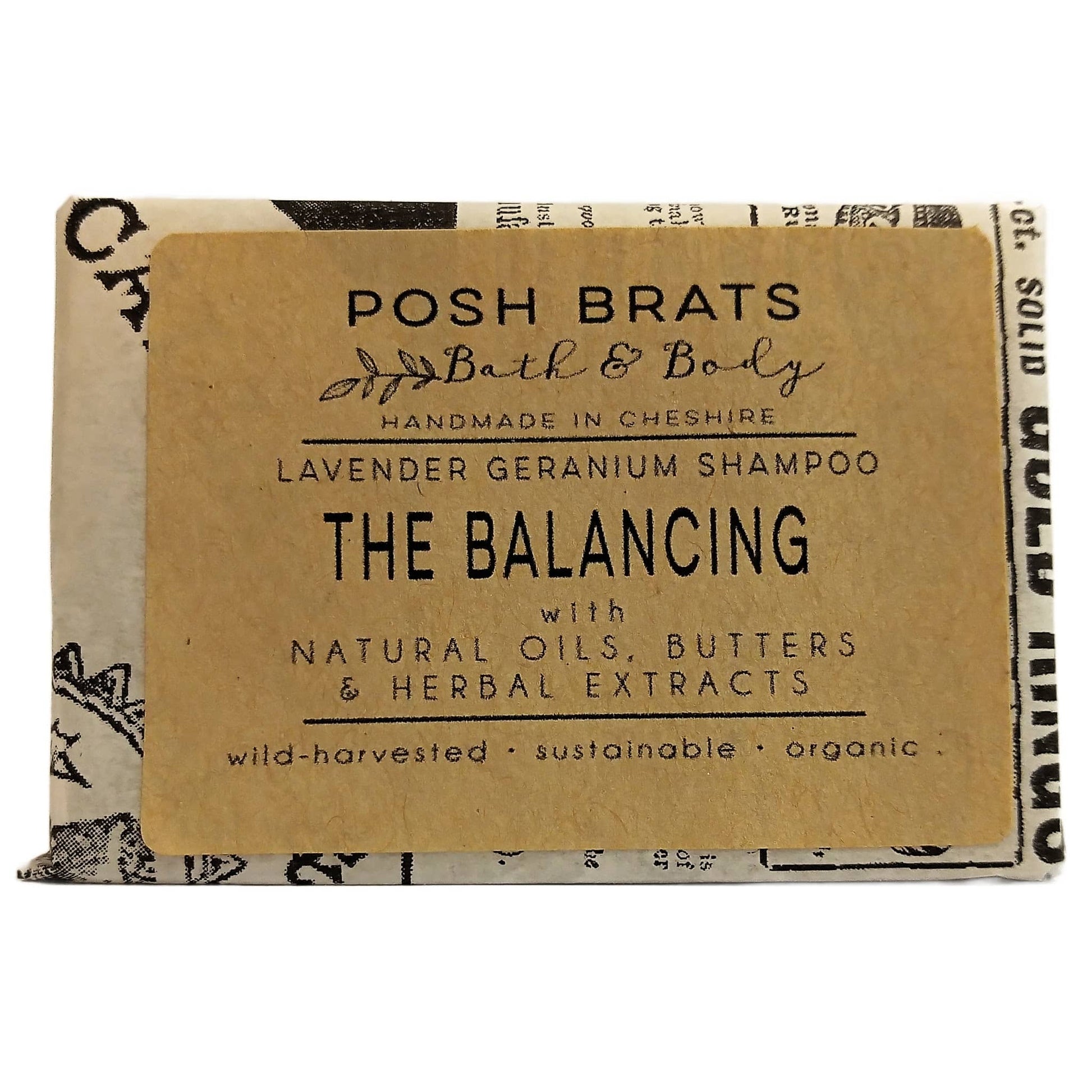 Bar of soap with 'Posh Brats Bath & Body' label on a white background