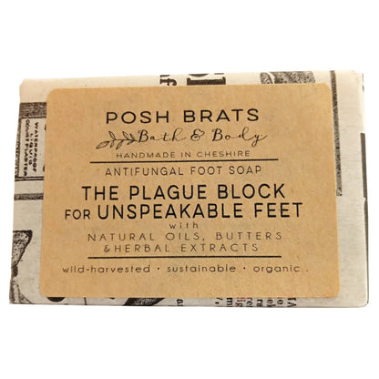 Bar of soap with a label reading 'Posh Brats Bath & Body' on a white background