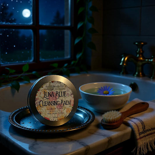 Luna Blue Cleansing Balm on a tray with a bowl of water and brush in a bathroom setting.