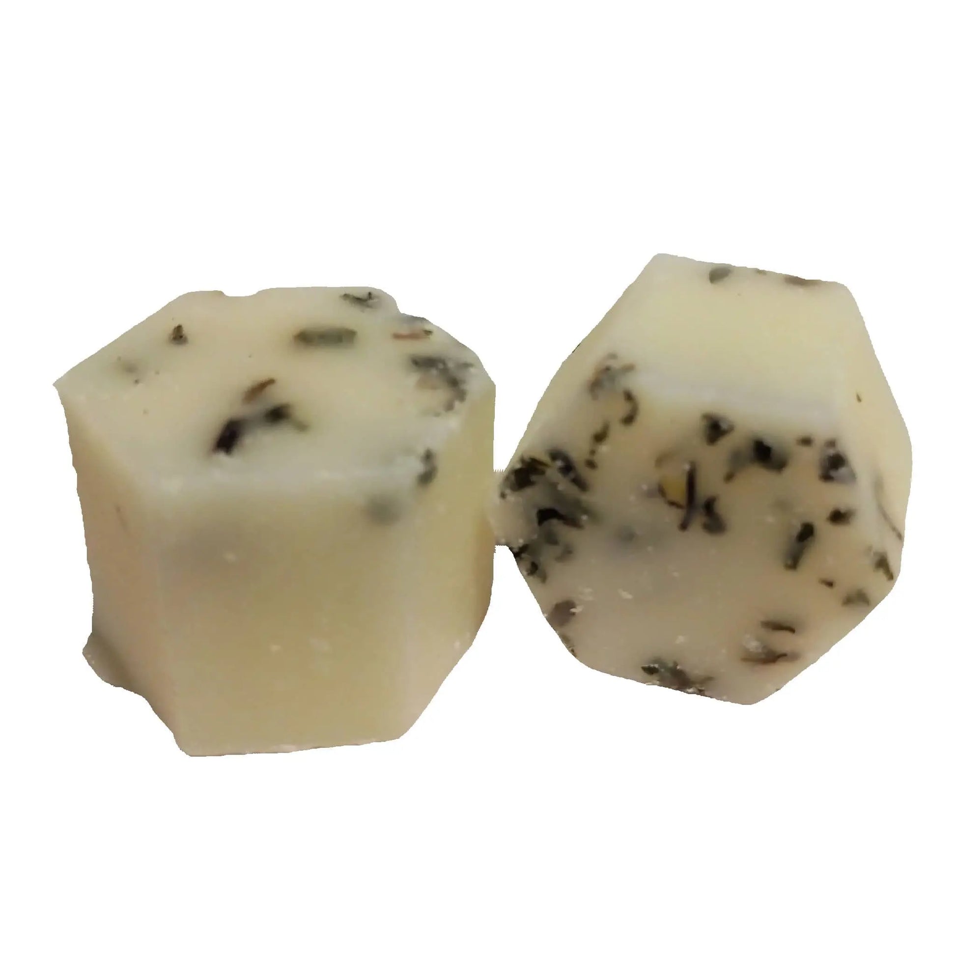 Two pieces of the Peppermint Botanical Butter Bath Melt by Posh Brats are shown on a plain white background. Resembling creamy shea butter, they have a smooth texture with small herb flecks throughout.