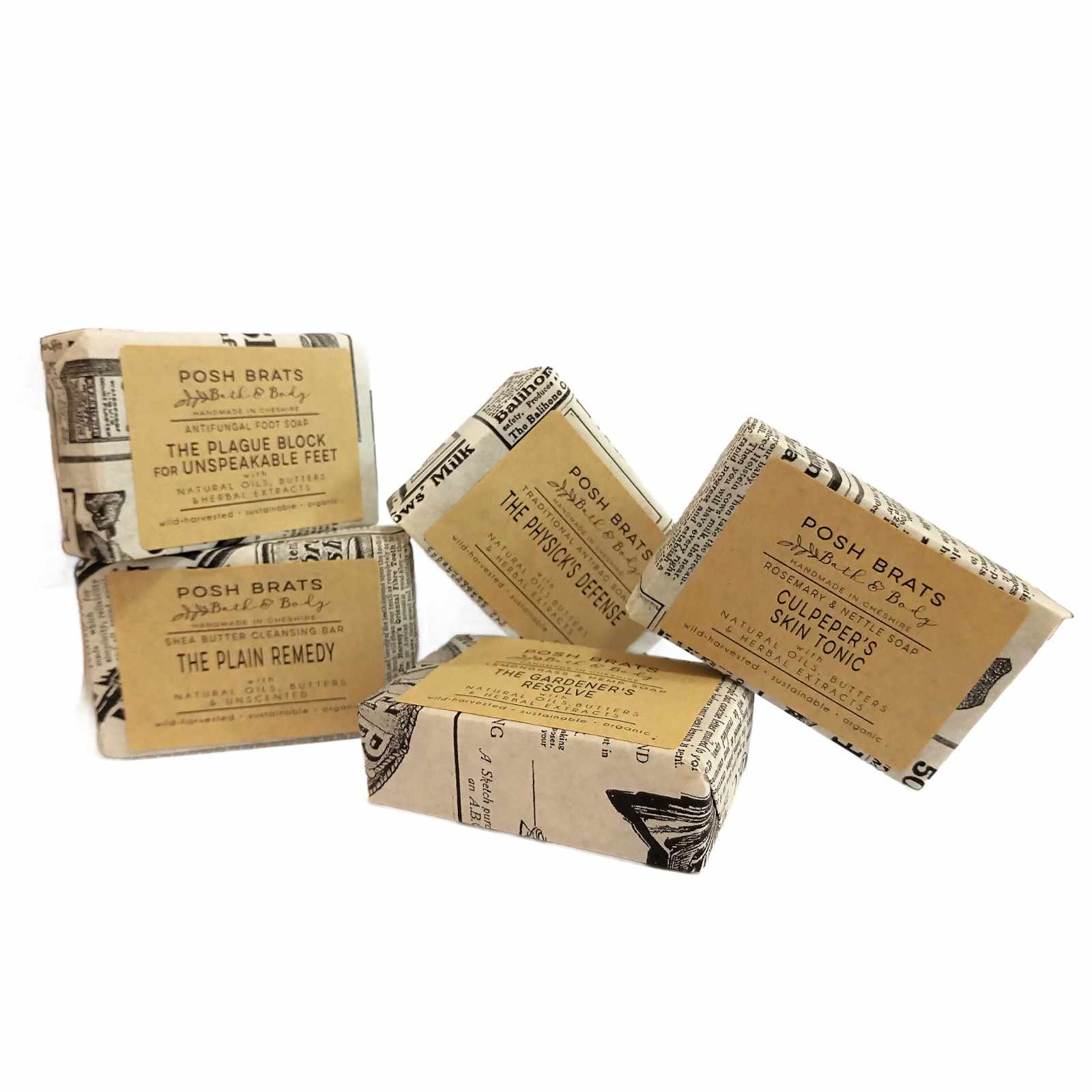 Five bars of soap in brown packaging with text on a white background