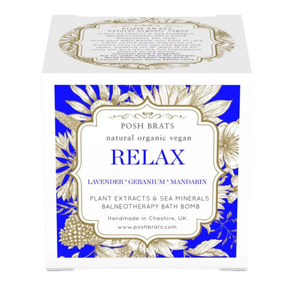 The Relax Aromatherapy Bath Bomb by Posh Brats features a blue and white floral design and is infused with lavender, geranium, and mandarin essential oils. It offers stress-relieving sea minerals in a natural vegan formulation. Handmade in Cheshire, UK, it promises balneotherapy bliss.